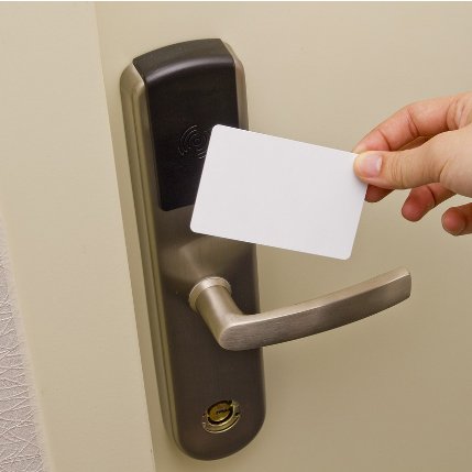 This is the image of an Acces card lock system on a door. This white card is used as a key to unlock the door.